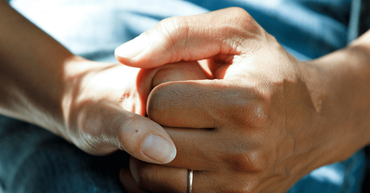 patients holding hands in hope for a good treatment outcome