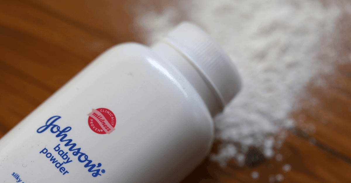 bottle of jnj talcum powder, spilled on table