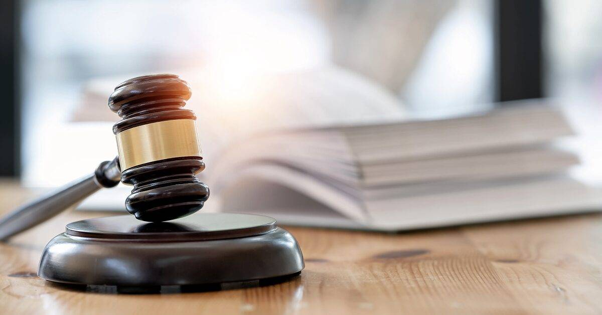 Wooden brown judge gavel on the table, copy space, banner background