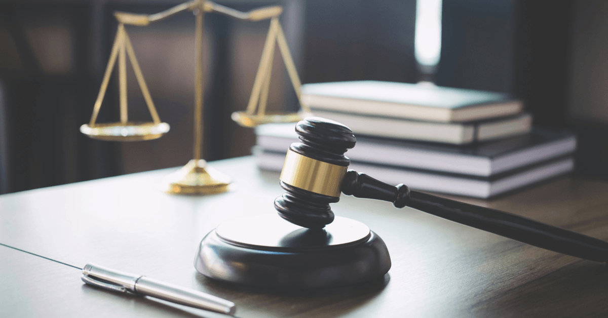 https://www.istockphoto.com/photo/scales-of-justice-and-gavel-on-wooden-table-and-lawyer-or-judge-working-with-gm939262058-256820558