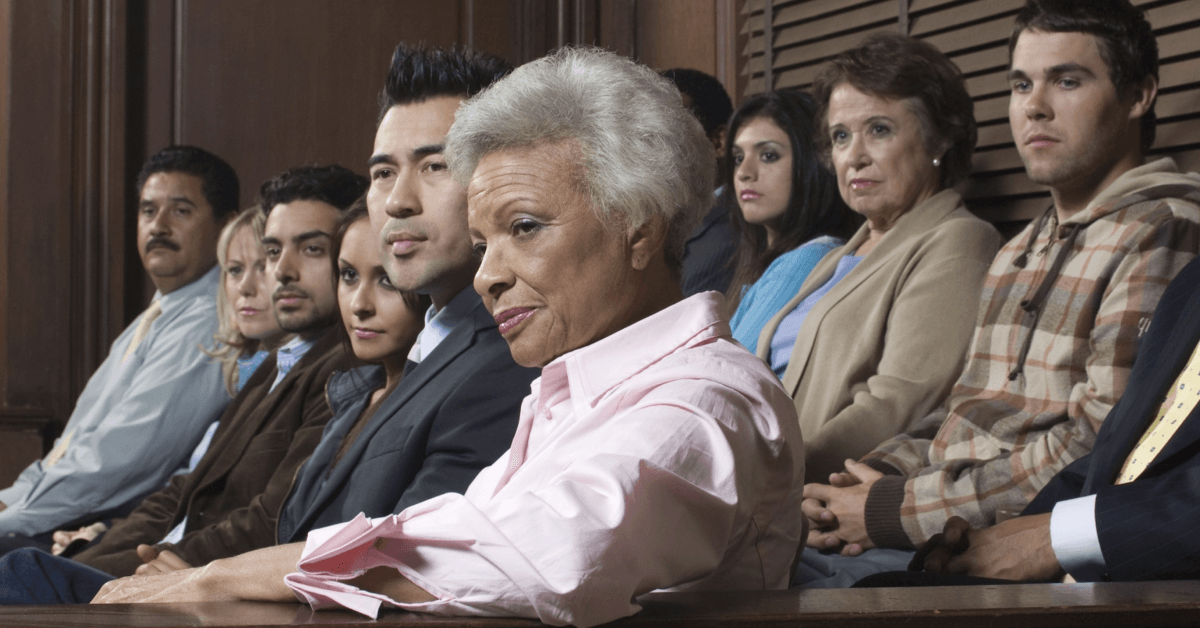 A diverse group of people sitting in a courtroom