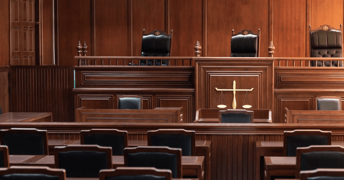 Red wood table and red chair in the justice court